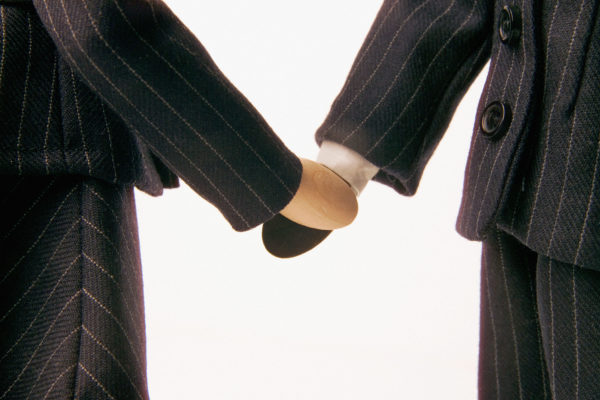 Businesspeople holding hands